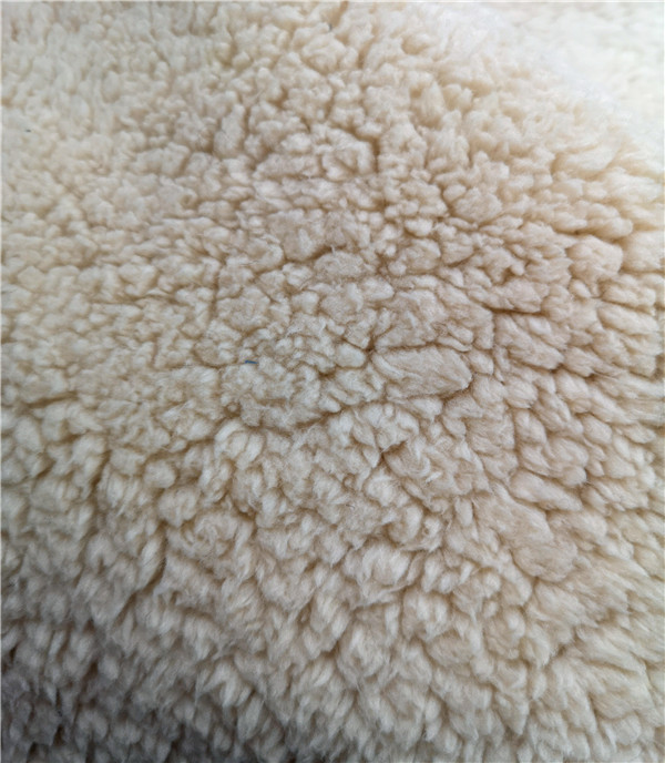Round top long pile coral faux fur