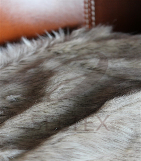 Gray wolf faux fur pillow