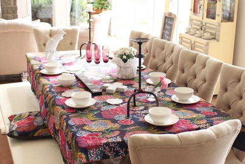 Use a colorful quilt as a table cover